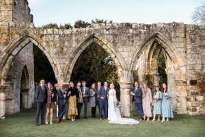 wedding party standing in front of romantic ruins on Birdsall Estates 