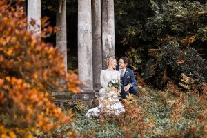 wedding couple at the temple in the Birdsall Estate 