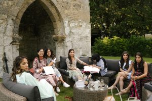 bridal party relaxing in the grounds of Birdsall House