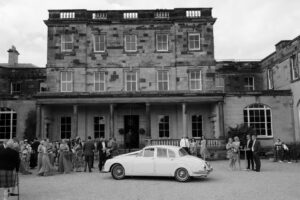 historic house wedding party and car