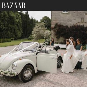 bridal party and wedding car
