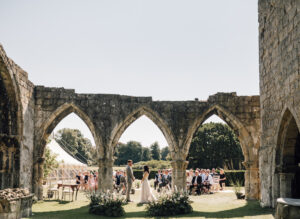 A couple get married under the ruins of an old Church