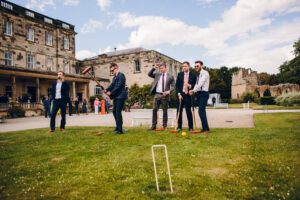men playing games at a wedding at Birdsall 